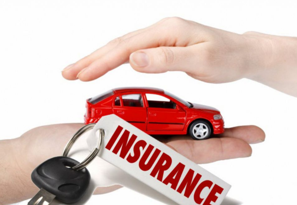 an auto insurance agent discussing policy options with a client at Insurance Company Dublin Ohio, specializing in comprehensive and affordable auto insurance coverage.
